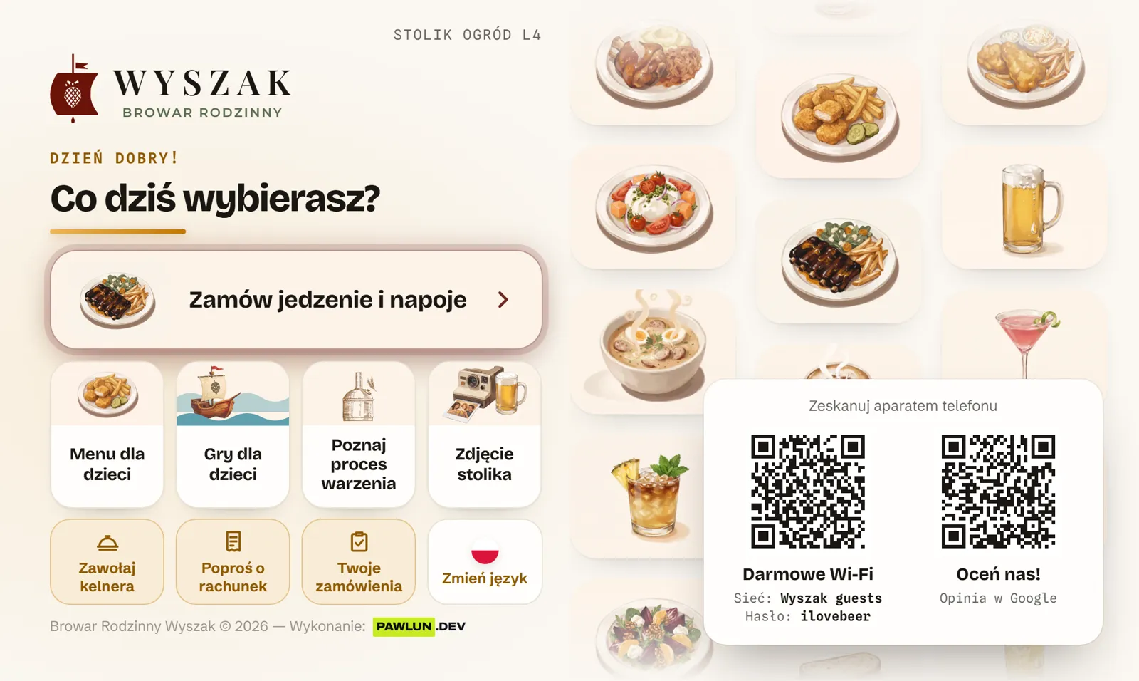 Ekran startowy tabletu na stole: wybór języka, karta, gry i zdjęcie stolika